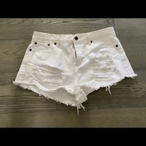 White ripped shorts